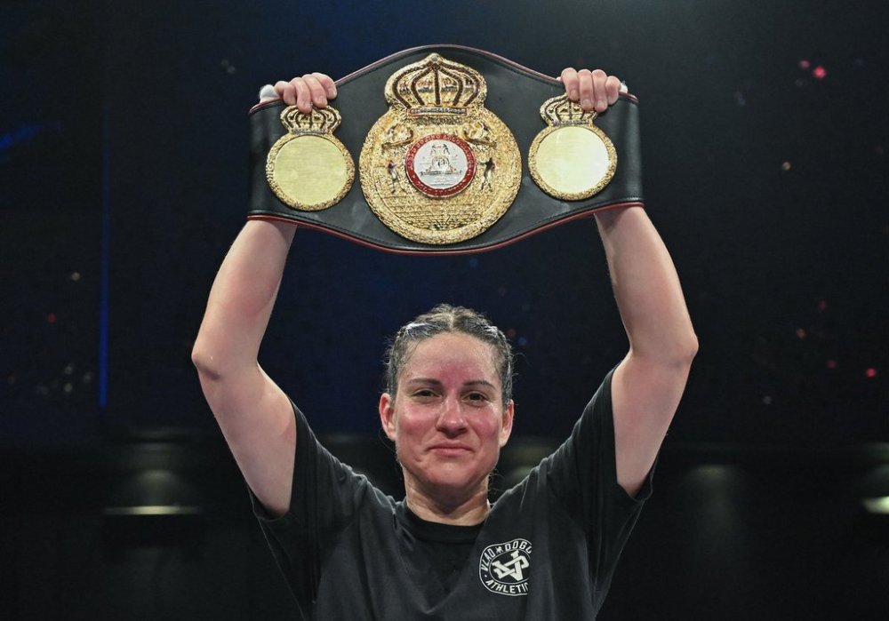 Mary Spencer holds up the belt following her victory over Ogleidis Suarez in their WBA World Super Welterweight Championship fight in Montreal, Thursday, April 10, 2025. THE CANADIAN PRESS/Graham Hughes
