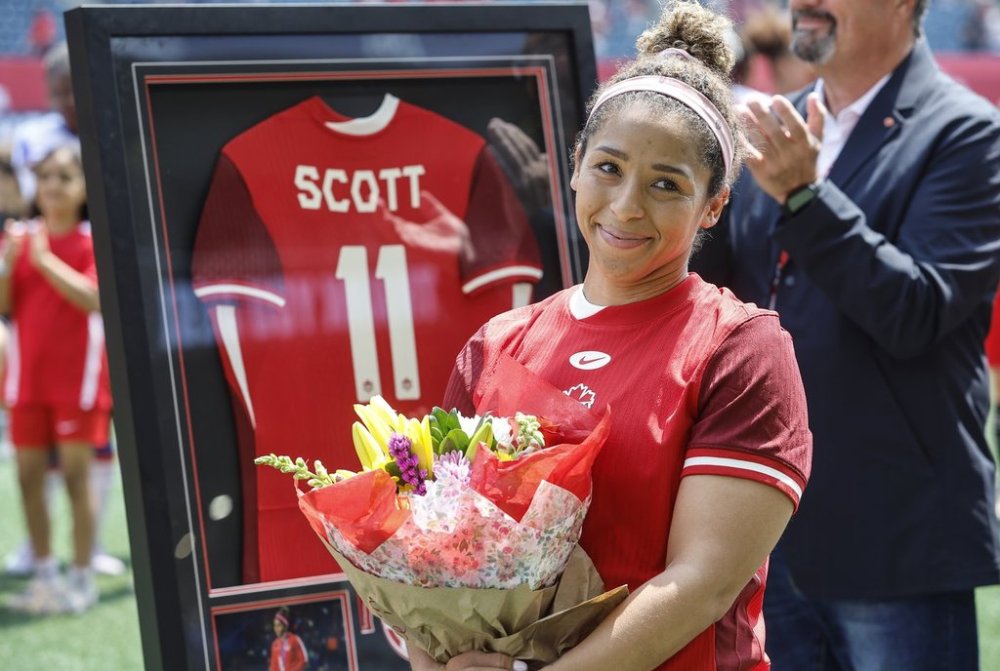 Canada's Desiree Scott (11), who is retiring from the national team, is honoured at a pre-game ceremony prior to their game against Haiti in Winnipeg, Saturday, May 31, 2025. THE CANADIAN PRESS/John Woods