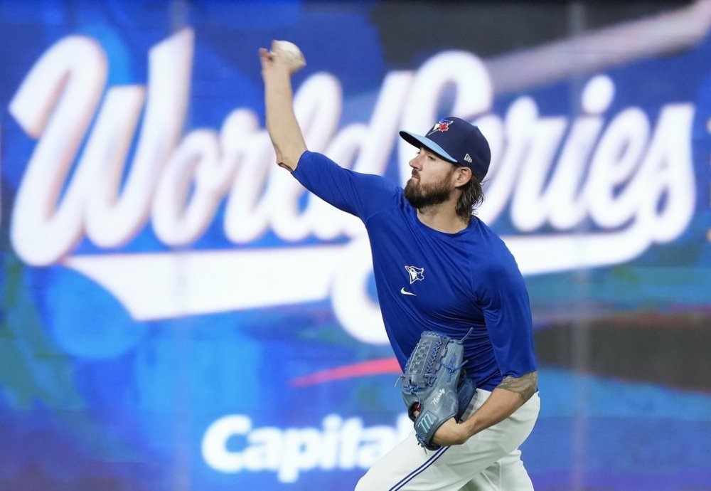 Toronto Blue Jays pitcher Kevin Gausman stretches out his arm during practice ahead of game 6 of the World Series against the Los Angeles Dodgers in Toronto on Thursday, Oct. 30, 2025. THE CANADIAN PRESS/Nathan Denette