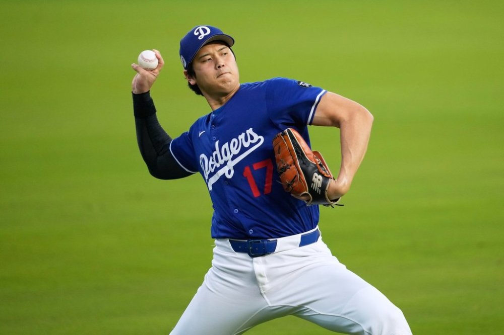 Los Angeles Dodgers' Shohei Ohtani works out ahead of Game 3 of the 2025 World Series against the Toronto Blue Jays in Los Angeles, Sunday, Oct. 26, 2025. (AP Photo/Ashley Landis)