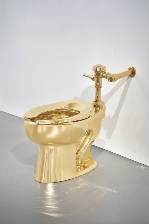 Sotheby’s has announced it will auction a solid gold toilet, a sculpture by Italian artist Maurizio Cattelan called “America.” The auction is set for Nov. 18 in New York. (Sotheby via AP)