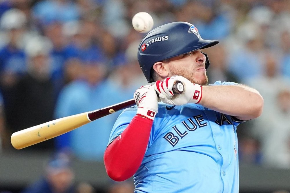 Toronto Blue Jays' Alejandro Kirk (30) reacts after being hit by a pitch during ninth inning Game 6 World Series playoff MLB baseball action against the Los Angeles Dodgers in Toronto on Friday, Oct. 31, 2025. THE CANADIAN PRESS/Frank Gunn
