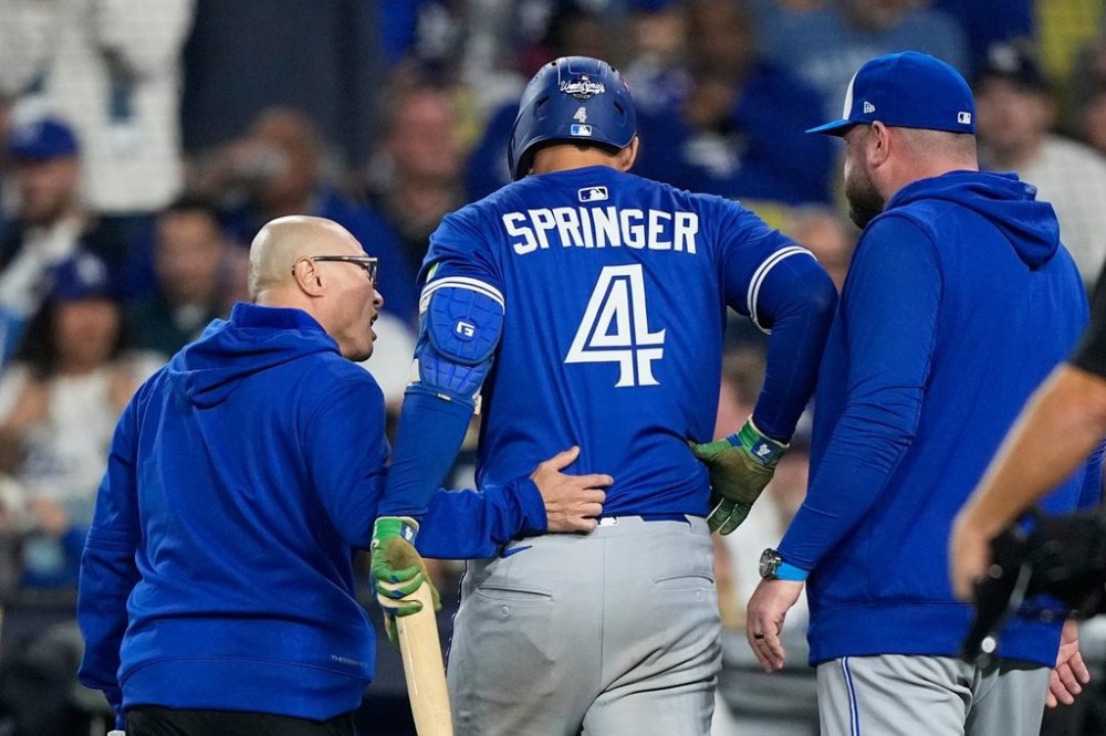 Toronto Blue Jays designated hitter George Springer leaves the game with an injury during the seventh inning in Game 3 of baseball's World Series against the Dodgers on Oct. 27, 2025, in Los Angeles. (AP Photo/Brynn Anderson)