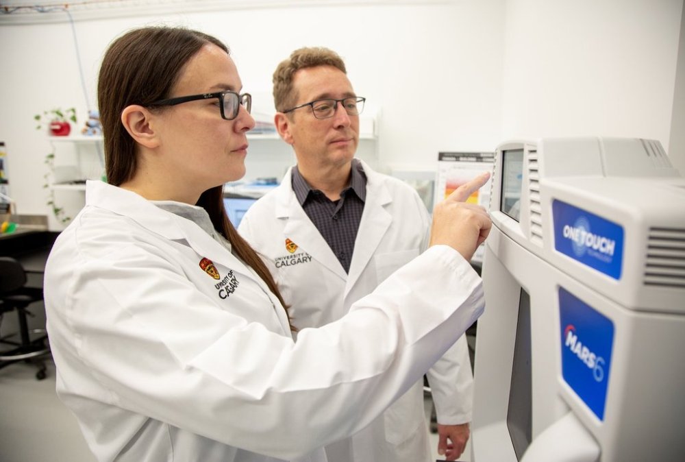 Researcher co-principal investigator Dr. Michael Wieser, PhD, physics professor in the Faculty of Science, right, and Dr. Kerri A. Miller are seen in this handout photo, in Calgary, on Wednesday, Oct. 8, 2025. The researchers are looking for toenail clippings to assist with a research study relating to lung cancer and radon levels. THE CANADIAN PRESS/Handout - Colleen De Neve for University of Calgary UToday (Mandatory Credit)