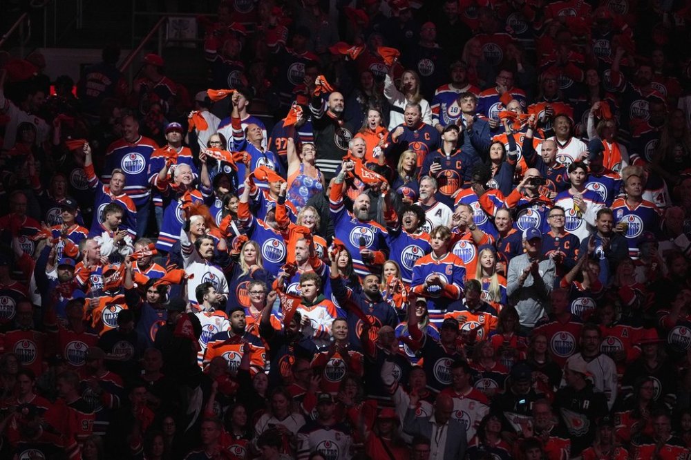 Robert Clark cheers with fans after singing the national anthems before the Edmonton Oilers and Florida Panthers play Game 1 of the NHL Stanley Cup Final, in Edmonton, on Wednesday, June 4, 2025. THE CANADIAN PRESS/Darryl Dyck