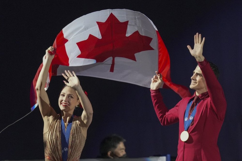 Gold medalists Piper Gilles and Paul Poirier, of Canada pose with their medals during the medal ceremony for the ice dance competition in the ISU Four Continents Figure Skating Championships at the Mokdong ice rink in Seoul, South Korea, Saturday, Feb. 22, 2025. (AP Photo/Lee Jin-man)