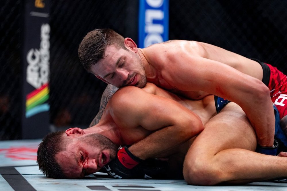 Brendan Allen, top, pins Reinier de Ridder during their middleweight bout at a UFC Fight Night in Vancouver, on Saturday, Oct. 18, 2025. THE CANADIAN PRESS/Ethan Cairns