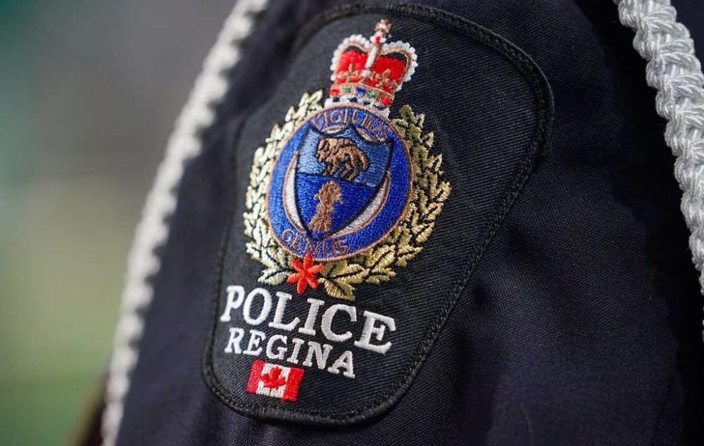 Regina Police Service badge can be seen on an officer’s uniform before CFL football action between the Saskatchewan Roughriders and the Calgary Stampeders in Regina, on Friday, July 11, 2025. THE CANADIAN PRESS/Heywood Yu