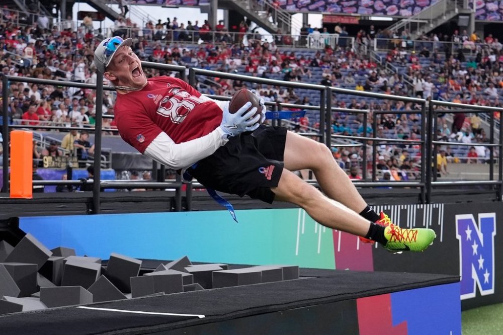 FILE - Arizona Cardinals tight end Trey McBride celebrates his touchdown jumping in a foam pit during the NFL Pro Bowl football game, Feb. 2, 2025, in Orlando, Fla. (AP Photo/John Raoux, File)