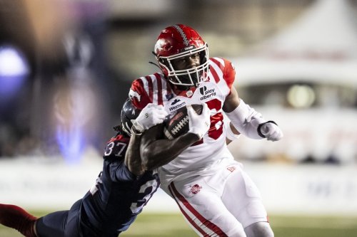 Montreal Alouettes' Wesley Sutton (37) tackles Calgary Stampeders' Dedrick Mills (26) during second half CFL action, in Montreal on Friday, Sept. 26, 2025. THE CANADIAN PRESS/Christopher Katsarov