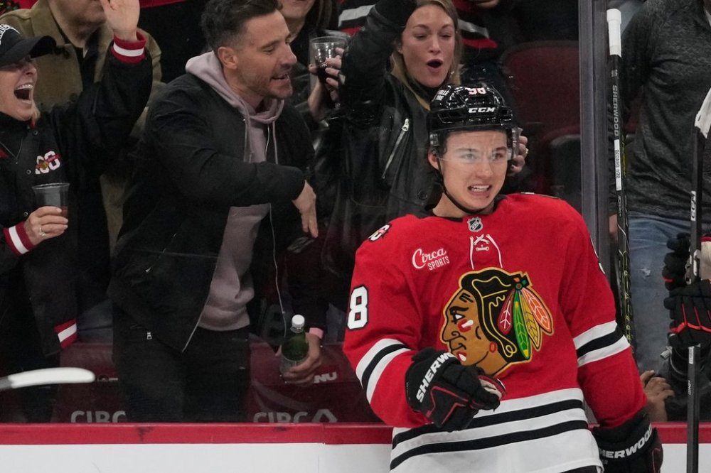Chicago Blackhawks centre Connor Bedard (98) celebrates his hat trick against the Ottawa Senators during the third period of an NHL hockey game Tuesday, Oct. 28, 2025, in Chicago. (AP Photo/Erin Hooley)