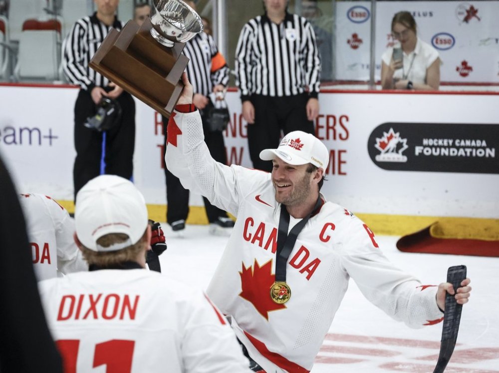 Team Canada forward Tyler McGregor (8) holds the trophy after defeating Team USA to win the World Para Ice Hockey Championship final in Calgary, Sunday, May 12, 2024.THE CANADIAN PRESS/Jeff McIntosh