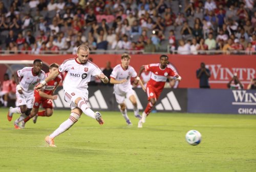 Toronto FC midfielder Djordje Mihailovic (10) takes a shot on the goal on a free kick during the second half of an MLS soccer match against Chicago Fire, Saturday, Oct. 4, 2025, in Chicago. (AP Photo/Talia Sprague)