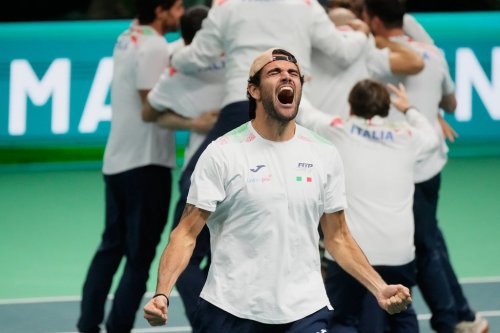 Italy's Matteo Berrettini, front, celebrates after Italy's Flavio Cobolli winning a Davis Cup final singles tennis match against Spain's Jaume Munar, in Bologna, Italy, Sunday, Nov. 23, 2025. (AP Photo/Luca Bruno)
