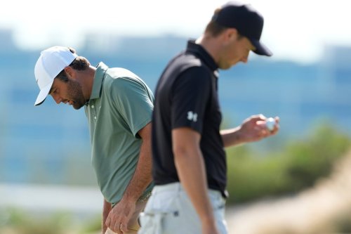 Scottie Scheffler, left, walks near Jordan Spieth, both of the United States, on the third green during the first round of the Hero World Challenge PGA Tour at the Albany Golf Club, in New Providence, Bahamas, Thursday, Dec. 4, 2025. (AP Photo/Fernando Llano)
