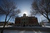 The sun peaks over the edge of the Brandon courthouse dome on Princess Avenue. (Matt Goerzen/The Brandon Sun)