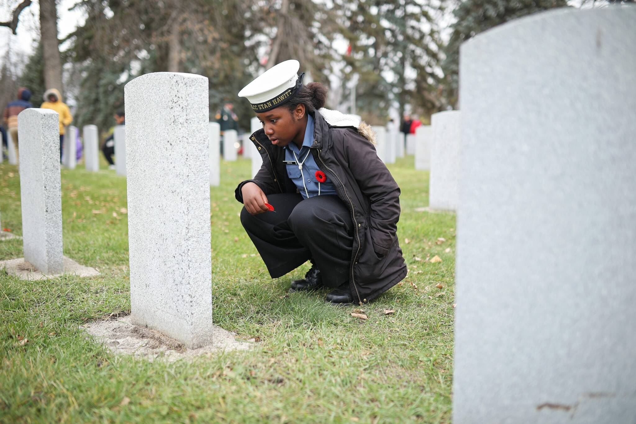 Students place poppies for war dead