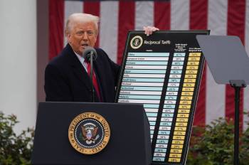 U.S. President Donald Trump holds a chart as he announces a plan for tariffs on imported goods during an event in the White House Rose Garden. (The Washington Post files)