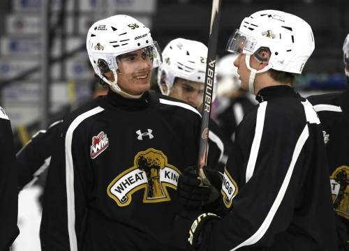 Brandon Wheat Kings defenceman Daniil Skvortsov, left, smiles as he talks to fellow defenceman Cameron Allard at practice at Assiniboine Credit Union Place on Monday afternoon. The big Russian defender is quickly settling in after being claimed from the Ontario Hockey League’s Guelph Storm earlier this month. (Perry Bergson/The Brandon Sun)
                                Nov. 18, 2025