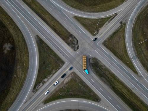 Vehicles navigate the Trans-Canada Highway and Highway 5 intersection north of Carberry on Monday. The provincial government is expected to announce today that it will build an overpass at the intersection, the scene of the worst motor-vehicle collision in Manitoba history. (Tim Smith/The Brandon Sun)