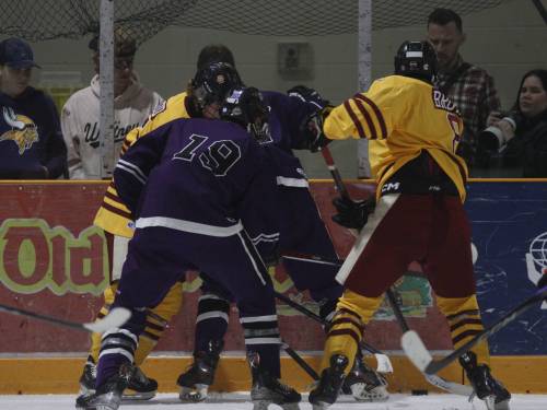 Massey forward Addax Egan (19) battles for a loose puck along the boards during Westman High School Hockey League action against the Crocus Plainsmen at Enns Brothers Arena on Sunday, Oct. 19.
                                (Massimo De Luca-Taronno/The Brandon Sun)