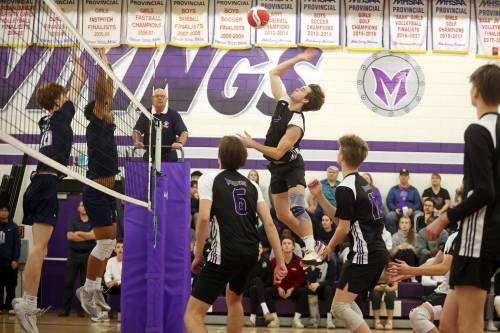 Logan Van Santen of the Vincent Massey Vikings attacks against the River East Kodiaks in the first round of AAAA varsity boys volleyball provincials at Massey on Thursday. (Tim Smith/The Brandon Sun)