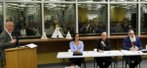 Assistant political science professor Rick Baker (from left), criminal defence attorney Jennifer Janssens, Crown attorney Rich Lonstrup, and sociology professor Chris Schneider spoke on a panel at Brandon University on Wednesday about bail and recent bills proposed by federal political parties. (WCGtv images)
