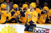 Nashville Predators left wing Reid Schaefer (49) is congratulated after scoring a goal against the Calgary Flames during the first period of an NHL hockey game Tuesday, Dec. 2, 2025, in Nashville, Tenn. (AP Photo/Mark Humphrey)