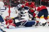 Florida Panthers goaltender Sergei Bobrovsky (72) falls to the ice as he defends the goal during the first period of an NHL hockey game against the Toronto Maple Leafs, Tuesday, Dec. 2, 2025, in Sunrise, Fla. (AP Photo/Lynne Sladky)