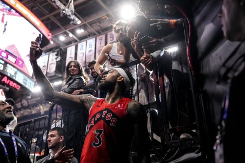 Toronto Raptors forward Brandon Ingram (3) takes a selfie with fans after his team's 110-99 win over Cleveland Cavaliers in NBA basketball action in Toronto on Monday November 24, 2025. THE CANADIAN PRESS/Chris Young