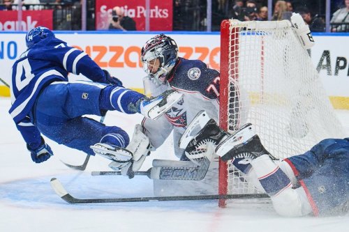 Maple Leafs winger Bobby McMann (74) collides with Columbus Blue Jackets goaltender Jet Greaves (73) in Toronto on Thursday, Nov. 20, 2025. THE CANADIAN PRESS/Sammy Kogan
