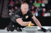 Team Jacobs skip Brad Jacobs throws a stone during Canadian Olympic curling trials finals action against Team Dunstone in Halifax on Saturday, November 29, 2025. THE CANADIAN PRESS/Darren Calabrese