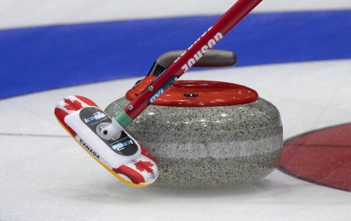 Canada skip Brad Gushue slows a rock during a practice session at the world curling championship on March 31, 2023 in Ottawa. THE CANADIAN PRESS/Adrian Wyld