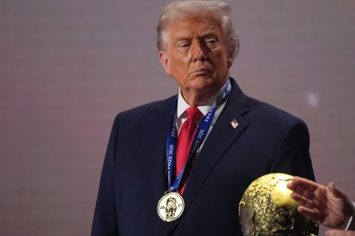 President Donald Trump stands on stage after receiving the FIFA Peace Prize during the draw for the 2026 soccer World Cup at the Kennedy Center in Washington, on Friday. (The Associated Press)