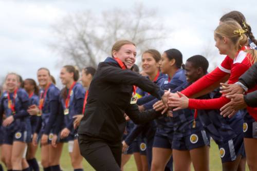 Brandon University athletic therapist Karine St. Kitts celebrates with the Bobcats women&rsquo;s soccer team after capturing the MCAC championship in October. (Thomas Friesen/The Brandon Sun)