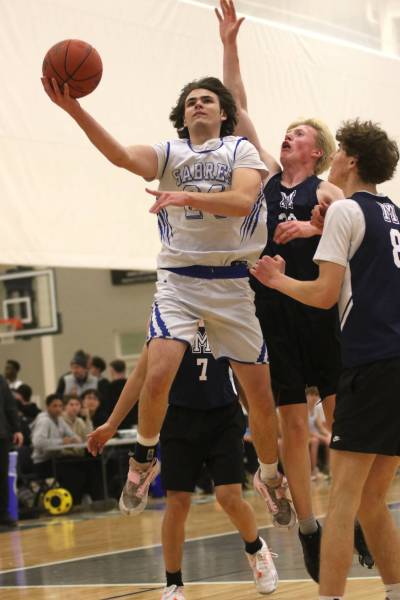 Souris Sabres guard Trey Penner does a layup against the Minnedosa Chancellors during their Brandon Sun Spartan Invitational varsity boys&rsquo; basketball game at the Healthy Living Centre on Thursday. (Thomas Friesen/The Brandon Sun)