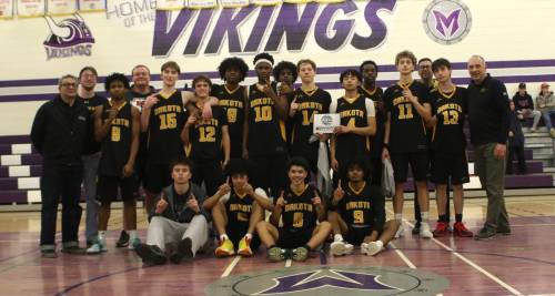 The Dakota Lancers celebrate their second Brandon Sun Spartan Invitational title in three years after beating the Oak Park Raiders at Vincent Massey on Saturday. (Thomas Friesen/The Brandon Sun)
