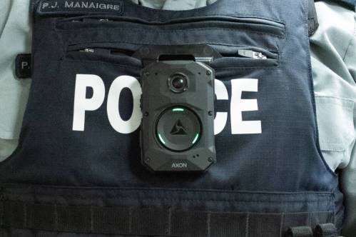 RCMP Sgt. Paul Manaigre, media relations officer with D Division, wears one of the body cameras the RCMP deployed to 44 detachments in Manitoba during a press conference in Steinbach last year. (Svjetlana Mlinarevic/The Carillon files)