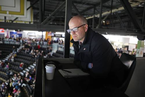 Video goal judge Jeff Sawchuk looks down at the ice ahead of the Brandon Wheat Kings game against the Kelowna Rockets at Assiniboine Credit Union Place on Friday. Sawchuk has done the job since the Western Hockey League added its program to start the 2009-10 season, currently rotating with Maurice Hutlet and Patrick Gagnon. (Tim Smith/The Brandon Sun)