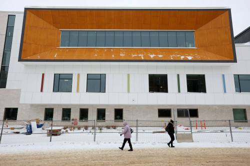 Visitors to the Brandon Regional Health Centre pass by the under-construction critical care building on Monday. The facility is scheduled to open early in the new year. (Tim Smith/The Brandon Sun)