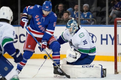 New York Rangers left wing Will Cuylle (50) attempt to shoot the puck during the first period of an NHL hockey game against Vancouver Canucks, Tuesday, Dec. 16, 2025, in New York. (AP Photo/Yuki Iwamura)