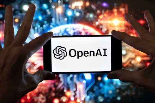 FILE - The OpenAI logo is seen displayed on a cell phone in front of an image on a computer screen generated by ChatGPT's Dall-E text-to-image model, Friday, Dec. 8, 2023, in Boston. (AP Photo/Michael Dwyer, file)
