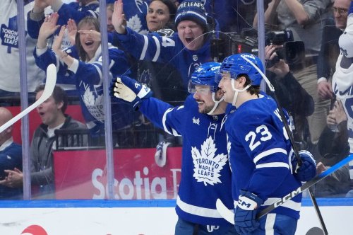 Toronto Maple Leafs forward Auston Matthews (34) celebrates his goal with teammate Matthew Knies (23) during third period NHL hockey action against the Chicago Blackhawks, in Toronto, Tuesday, Dec. 16, 2025. THE CANADIAN PRESS/Nathan Denette