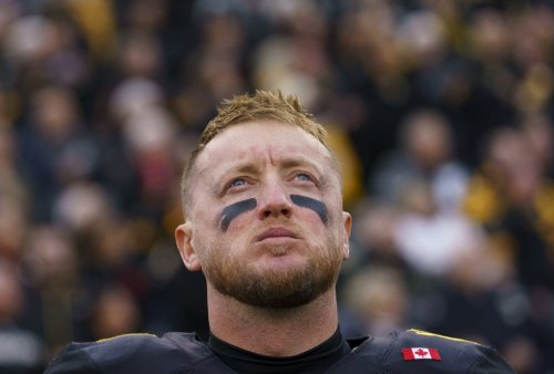 Tiger-Cats quarterback Bo Levi Mitchell stands on the field during the CFL East Final against the Montreal Alouettes in Hamilton, Ont., on Nov. 8, 2025. THE CANADIAN PRESS/Peter Power