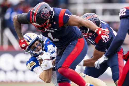 Montreal Alouettes' Darnell Sankey (1) hits Winnipeg Blue Bombers' Joey Corcoran (81) during first half Eastern semi-final action, in Montreal on Saturday, Nov. 1, 2025. THE CANADIAN PRESS/Christopher Katsarov