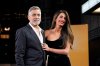 FILE - George Clooney and his wife Amal Clooney pose for photographers upon arrival at the screening of the film 