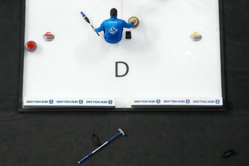 Matt Dunstone prepares to throw a rock during Canadian Olympic curling trials action against Team Koe in Halifax, Tuesday, Nov. 25, 2025. THE CANADIAN PRESS/Darren Calabrese