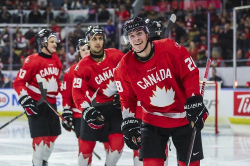 Canada's Brady Martin (28) leads teammates toward the bench following his goal during second period IIHF World Junior Hockey Championship pre-tournament action against Sweden in Kitchener, Ont. on Wednesday, Dec. 17, 2025. THE CANADIAN PRESS/Nick Iwanyshyn