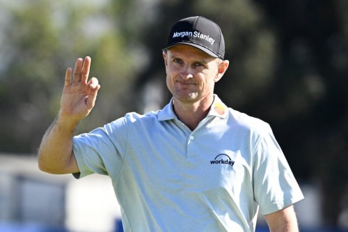 Justin Rose, of England, waves to the gallery on the 15th green of the South Course at Torrey Pines during the final round of the Farmers Insurance Open golf tournament Sunday, Feb. 1, 2026, in San Diego. (AP Photo/Denis Poroy)