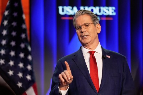 U.S. Secretary of the Treasury Scott Bessent delivers a speech at the USA House during the annual meeting of the World Economic Forum in Davos, Switzerland on Tuesday, Jan. 20, 2026. (AP Photo/Markus Schreiber)